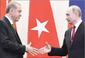  ?? ALEXANDER NEMENOV/AFP ?? Russian President Vladimir Putin (right) shakes hands with his Turkish counterpar­t Recep Tayyip Erdogan meet in Sochi on May 3.