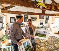  ??  ?? Andy and Elaine Grinter in their light-filled art gallery, formerly a flax combing mill, which is tucked down Green Dragon Yard.