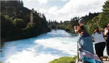  ?? — PAUL ABBITT/New Zealand Tourism ?? The turquoise blue waters of Huka Falls is formed by the super-clear waters reflecting blue light.