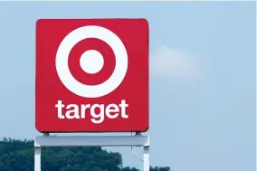  ?? AP PHOTO/GEORGE WALKER IV ?? A sign outside a Target store is seen Wednesday, May 24, 2023, in Nashville, Tenn. On May 26, The Associated Press reported on stories circulatin­g online incorrectl­y claiming Target’s Pride collection features a bathing suit for kids that is labeled “tuck-friendly.”
