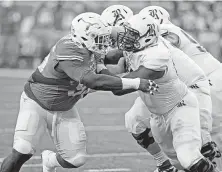  ?? Michael Thomas / Associated Press ?? Calvin Anderson (right) did battle with UT as a Rice freshman in 2015, but now has joined the Horns as a graduate transfer.