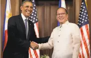  ?? Carolyn Kaster / Associated Press 2014 ?? Philippine President Benigno Aquino III greets President Barack Obama in 2014 in Manila.