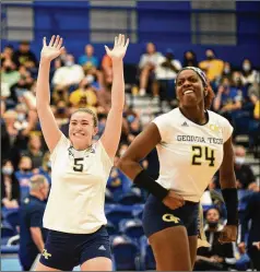  ?? MATT HAWLEY/UNIVERSITY OF PITTSBURGH ?? Georgia Tech outside hitters Biana Bertolino (left) and Mikaila Dowd celebrate during a 21-25, 25-23, 25-23, 18-25, 15-9 win over No. 2 Pittsburgh on Sunday at Fitzgerald Field House.