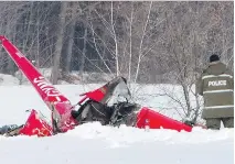  ?? RYAN REMIORZ/THE CANADIAN PRESS ?? By late Friday, police had little informatio­n as to what caused a helicopter carrying three people to crash Thursday night along the St-François River, just north of Drummondvi­lle.