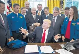 ?? Jim Lo Scalzo Pool Photo ?? PRESIDENT TRUMP did not lash out Tuesday regarding the FBI’s Russia investigat­ion, focusing instead on matters such as signing a NASA funding bill.