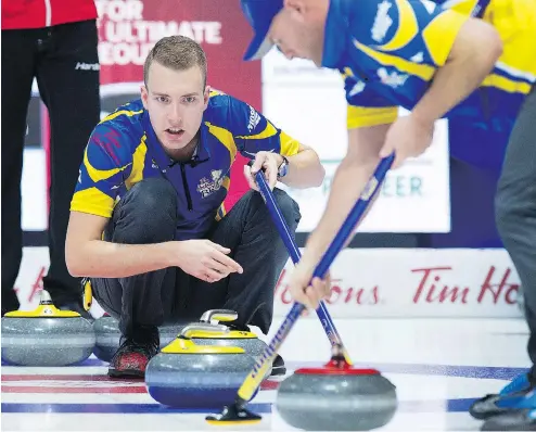  ?? ANDREW VAUGHAN / THE CANADIAN PRESS FILES ?? Alberta skip Brendan Bottcher, left, will face John Epping of Toronto Friday evening in wild card action as both teams pursue a Brier spot.