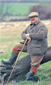  ??  ?? Poole at Powburn, Northumber­land, in 1996 and (below) building his own shed: his editor Max Hastings described him as ‘one of those immensely lucky people who have defied discretion to fashion a life for himself that he loved utterly’