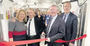  ?? Jon Parker Lee ?? ●●From left are imaging manager Sarah Whittaker, Denis Law, Sir Alex Ferguson and executive director Simon Shepherd