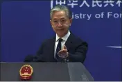  ?? LIU ZHENG — THE ASSOCIATED PRESS ?? In this image made from video, Chinese Foreign Ministry spokespers­on Wang Wenbin gestures as he speaks during a media briefing at the Ministry of Foreign Affairs office in Beijing, on Monday.