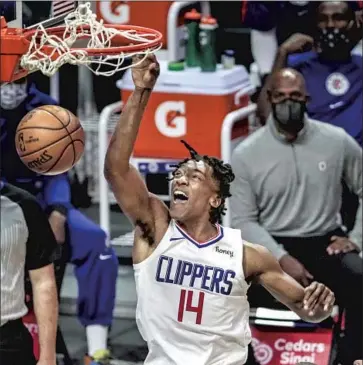  ?? Robert Gauthier Los Angeles Times ?? TERANCE MANN has earned a place in the Clippers’ rotation in his second season thanks to his hustle, hard work and energy. “He’s just making winning plays. He’s just doing everything right,” center Ivica Zubac says.