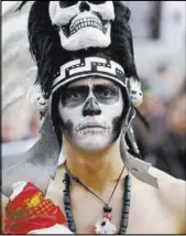  ??  ?? A supporter of the Bears Ears and Grand Staircase-Escalante national monuments at a rally Saturday in Salt Lake City.