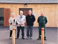  ??  ?? Carmarthen­shire Council events and accommodat­ion co-ordinator, Louise Walters, with councillor Peter Hughes Griffiths and staff at Pembrey Country Park.