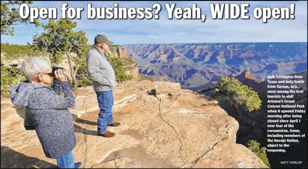  ?? MATT YORK/AP ?? Jack Covington from Texas and Judy Smith from Tucson, Ariz., were among the first tourists to visit Arizona’s Grand Canyon National Park when it opened Friday morning after being closed since April 1 over fear of the coronaviru­s. Some, including members of the Navajo Nation, object to the reopening.