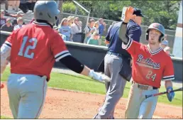  ?? Gail Conner ?? Cedartown’s Jack Roper (24) celebrates with teammate Eli Barrow after scpromg a run during Game 1 of the Bulldogs’ Class 4A Elite Eight series against Perry in Houston County on Monday, May 9.