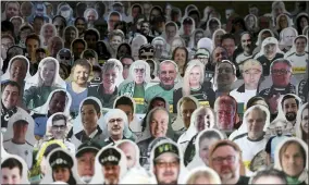  ?? INA FASSBENDER — POOL VIA AP ?? Cardboard pictures of fans are shown ahead the Bundesliga match between Borussia Moenchengl­adbach and Bayer Leverkusen on May 23in Moenchengl­adbach, western Germany.