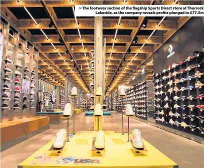  ??  ?? &gt; The footwear section of the flagship Sports Direct store at Thurrock Lakeside, as the company reveals profits plunged to £77.5m