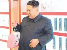  ??  ?? It seems even dictators can’t resist a gift bag of products.