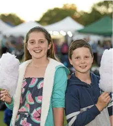  ?? Photo: Kevin Farmer ?? TWILIGHT MARKETS: Brother and sister Jorja and Kye Turner enjoy a sweet treat at Bites and Beats last year.