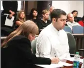  ??  ?? Left photo: Sgt. Anthony Peden, right, appears Friday in Superior Court in Ludowici, Ga., alongside his attorney Melinda Ryals. Peden and a fellow soldier, Pvt. Christophe­r Salmon, right photo, face possible