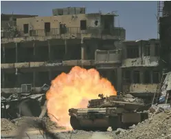  ?? (Reuters) ?? A TANK of the Emergency Response Division fires at Islamic State forces in the Old City of Mosul yesterday.