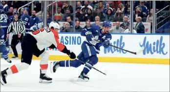  ?? (ARLYN MCADOREY/ THE CANADIAN PRESS VIA AP) ?? Toronto Maple Leafs centre Auston Matthews (34) scores while being defended by Flyers defenceman Travis Sanheim (6) during second period NHL hockey action on Thursday.