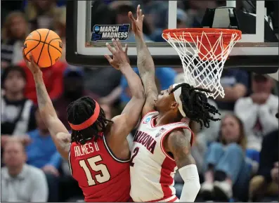  ?? (AP/Rick Bowmer) ?? Arizona guard Caleb Love (2) defends as Dayton forward DaRon Holmes II (15) shoots during the second half of a second-round game in the NCAA Tournament on Saturday in Salt Lake City.