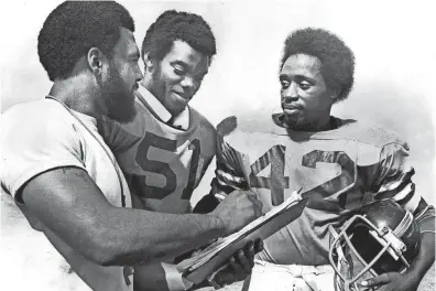  ??  ?? The subject was football when Melrose coach Ralph Patterson, left, got together with Stanley Wright, center, and James Stewart in October 1975. THOMAS BUSLER/THE COMMERCIAL APPEAL