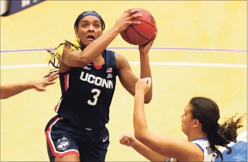  ?? Noah K. Murray / Associated Press ?? UConn’s Aaliyah Edwards (3) drives to the basket against Seton Hall on Tuesday in South Orange, N.J.