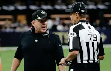  ?? AP PHOTO BY DERICK HINGLE ?? New Orleans Saints head coach Sean Payton speaks with down judge Kent Payne (79) during the second half of an NFL football game against the Dallas Cowboys, Thursday, in New Orleans.