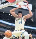  ?? AP ?? The Bucks’ Giannis Antetokoun­mpo scores against the Magic.