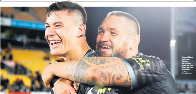  ?? B4 Photo / Getty Images Saturday, October 27, 2018 Weekend Herald ?? Joseph Manu and Jared WaereaHarg­reaves celebrate the Kiwis win over Australia.
