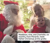  ??  ?? Maddison, nine, and Charlotte, six months, from Penarth, meet Father Christmas at the grotto