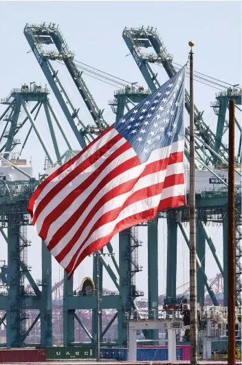  ?? MARK RALSTON/AFP/GETTY IMAGES ?? The Port of Long Beach in Los Angeles County. Some analysts say they think the U.S. economy could dip into recession next year, but White House officials predict that growth will surpass the expectatio­ns of most economists by improving to 3.2 per cent this year.