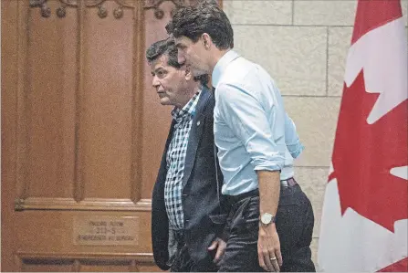  ?? JUSTIN TANG
THE CANADIAN PRESS ?? Prime Minister Justin Trudeau and Unifor national president Jerry Dias make their way to a meeting on Parliament Hill in Ottawa on Tuesday.