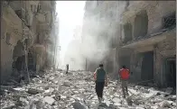  ?? ABDALRHMAN ISMAIL / REUTERS ?? Men inspect the damage after an airstrike in Aleppo, Syria, on Sunday.