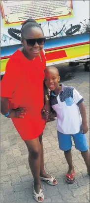 ??  ?? HERE TO HAVE FUN: At the Tamboekie festival last Friday was Siphokazi Mavangwe with her son Imanathi ENJOYING THE
RIDE: Esona Mtswera from Zote Junior Secondary School was having a great time on the rides at the Tam
boekie Festival