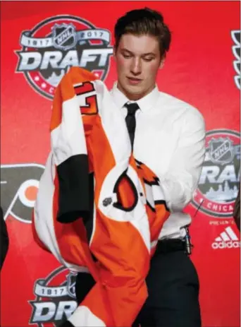  ?? NAM Y. HUH — THE ASSOCIATED PRESS ?? Nolan Patrick, here putting on a Flyers sweater for the first time last Friday night, scheduled a hernia surgery on his own, saving time for his recovery and setting him up be ready to go in the fall. to
