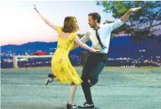  ?? THE ASSOCIATED PRESS ?? Emma Stone and Ryan Gosling star in the Oscar-winning movie musical “La La Land.”