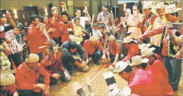  ??  ?? Kenyah men and youths in action during the ‘Pelubit Batu Tului’ session, a tradition which symbolises the journey of life.