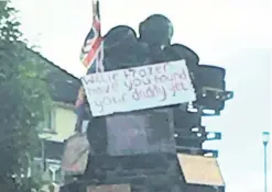  ??  ?? From left: Placard on bonfire; Willie Frazer, and his father Bertie, who was killed by the IRA in 1975