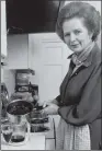  ??  ?? CULINARY ADVICE: Margaret Thatcher in the kitchen of her flat at 10 Downing Street.