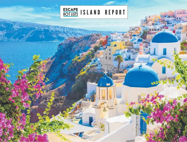  ?? ?? Oia village on Santorini island, Greece, features traditiona­l white houses and churches with blue domes.