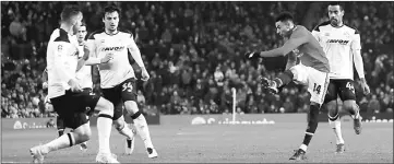  ??  ?? Manchester United’s Jesse Lingard scores their first goal during the FA Cup third round match against Derby County at Old Trafford. — Reuters photo