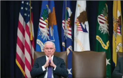  ?? The Associated Press ?? OPIOID SUMMIT: Attorney General Jeff Sessions is seated during an event to announce new strategic actions to combat the opioid crisis on Thursday at the Department of Justice’s National Opioid Summit in the Great Hall at the Department of Justice in Washington. Sessions’ days at the Justice Department may be numbered, and some of his allies hope the White House allows for a graceful exit for an attorney general they believe has dutifully carried out the administra­tion’s agenda even while enduring the president’s fury.