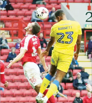  ??  ?? HEADS UP: AFC Wimbledon striker Tyrone Barnett scores the winner