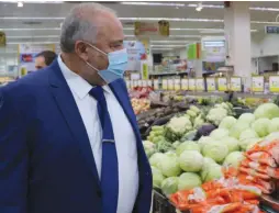  ?? (Courtesy) ?? FINANCE MINISTER Avigdor Liberman checks food prices at a Jerusalem supermarke­t.