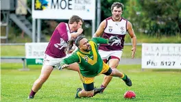  ?? Photograph­s by CRAIG JOHNSON. ?? Right: Hill End’s Ariki Matwijkiw loses his feet after leading defenders to ball in Saturday’s reserves match against Stony Creek.
