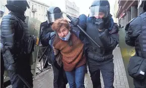  ?? DMITRI LOVETSKY/AP ?? Police make an arrest during a protest against the jailing of opposition leader Alexei Navalny in St. Petersburg, Russia, on Sunday.