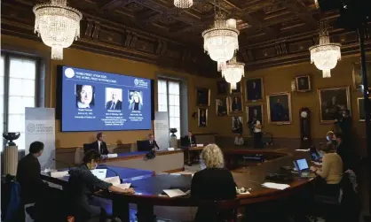  ?? Photograph: Fredrik Sandberg/AP ?? Goran K. Hansson, secretary general of the Academy of Sciences (centre) announces the winners of the 2020 Nobel prize in physics at the Royal Swedish Academy of Sciences, in Stockholm on Tuesday.