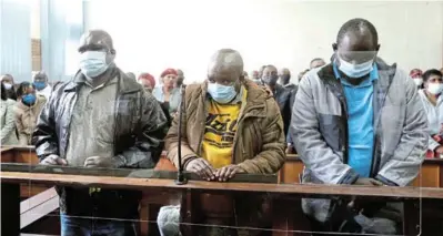  ?? / THAPELO MOREBUDI ?? Sipho Mkhatshwa, Philemon Lukhele and Albert Gama appearing in the Nelspriut magistrate’s court for the kidnapping and murder of Hillary Gardee.